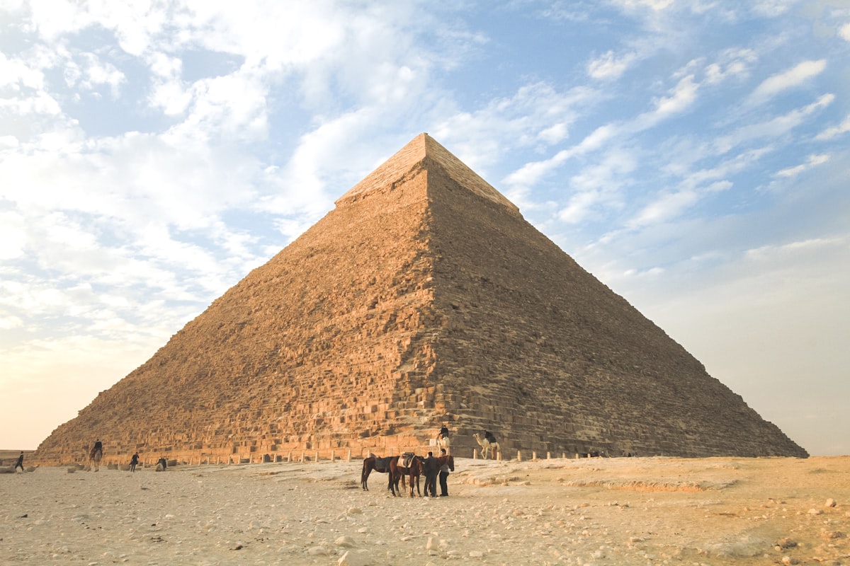 Family walking near historic Egyptian architecture at a comfortable pace